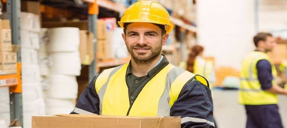 A man smiling while working